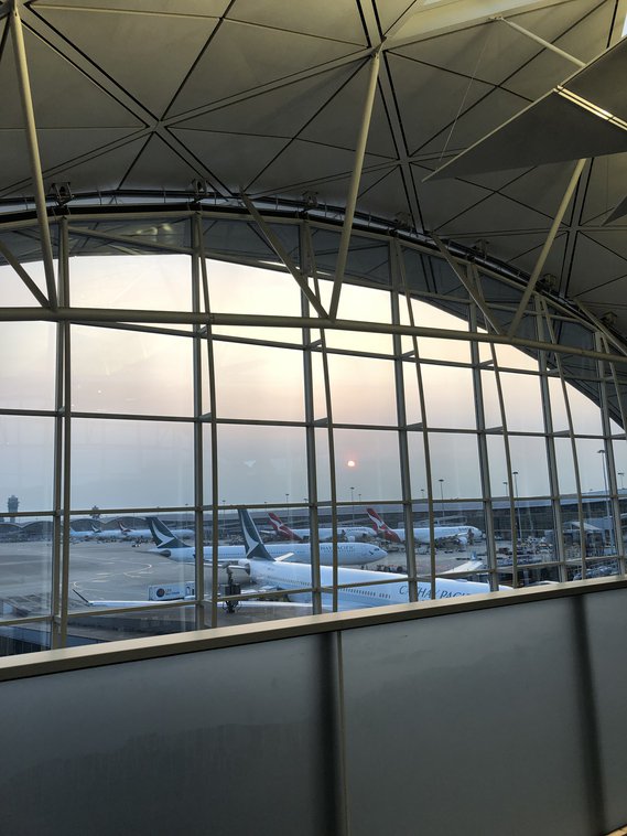 The sun sets on Hong Kong International Airport, one of the best airports to transit through.