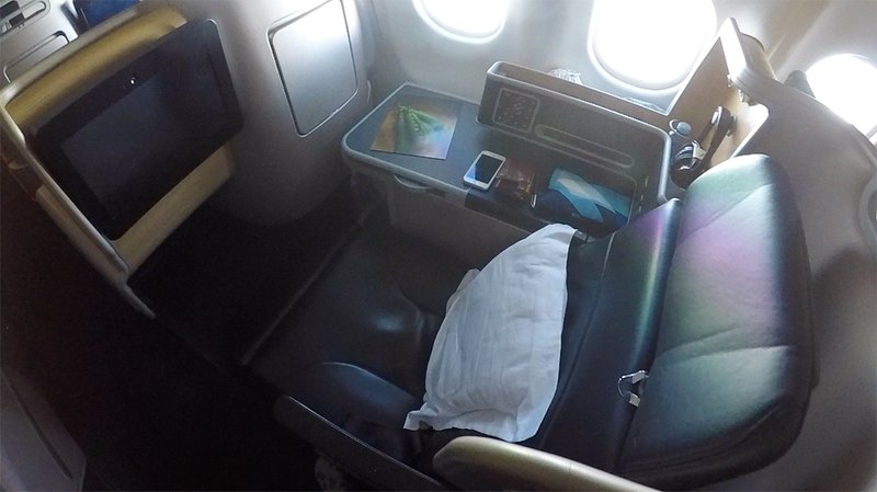 The Qantas Business Suite seat reclined.