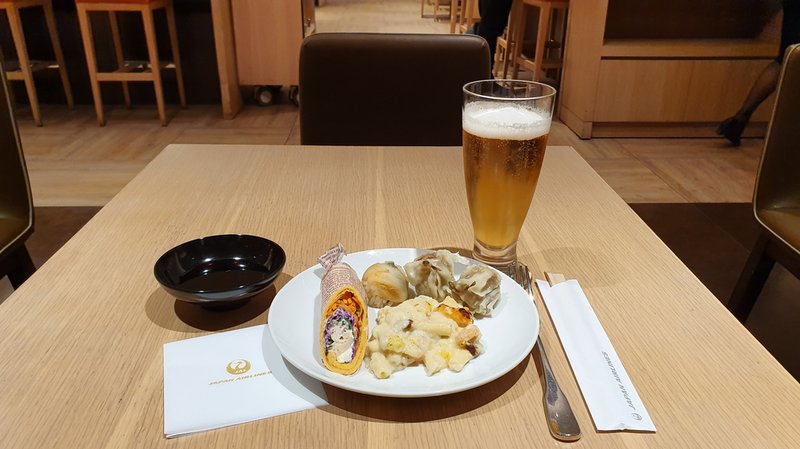 My main, beer, chicken wrap, conger eel sushi balls, shumai pork dumplings and shrimp cream macaroni gratin.